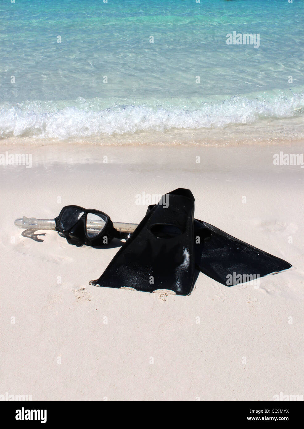 Snorkeling equipment on the sandy shore of a tropical beach Stock Photo