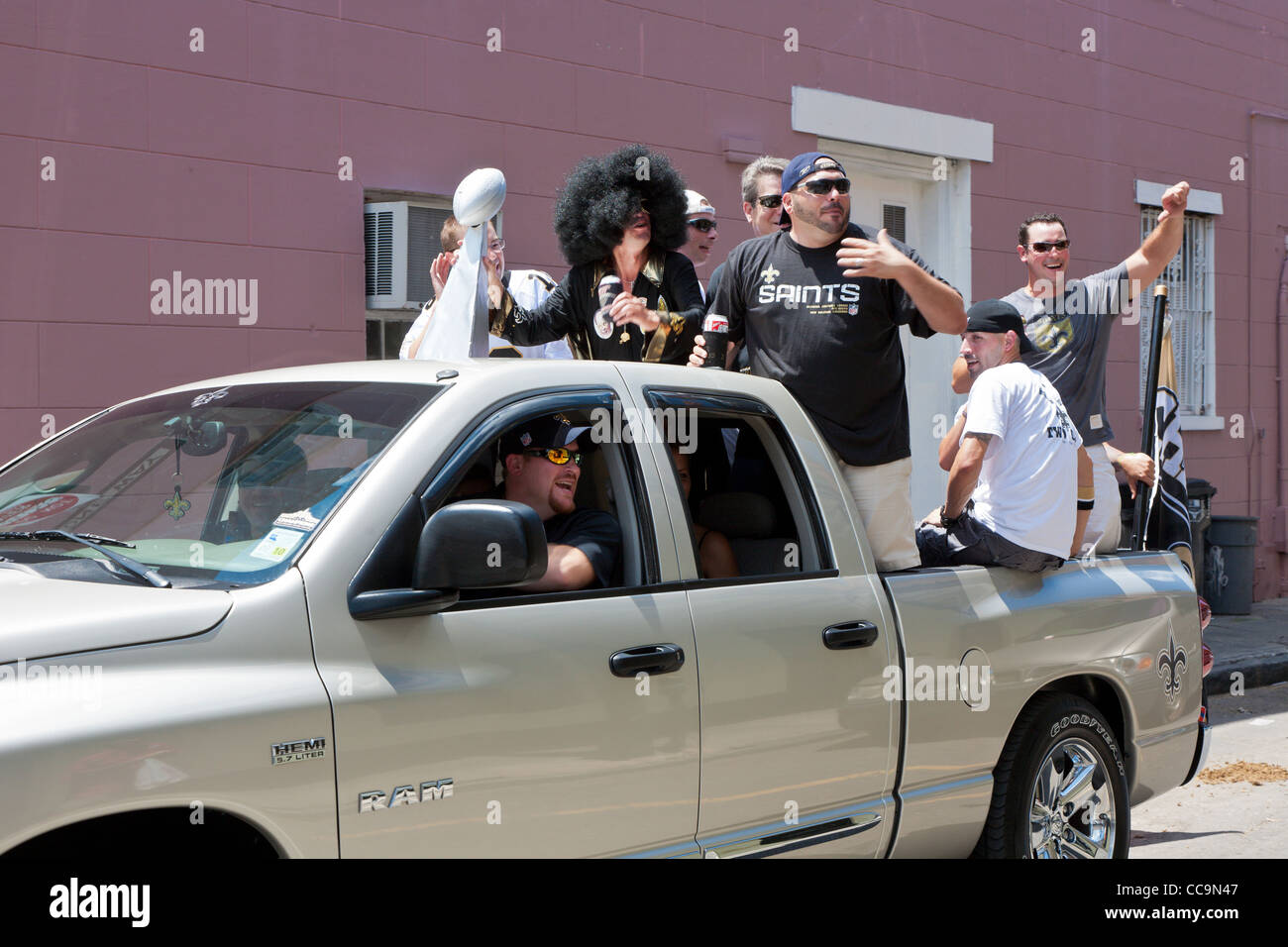 Fans of the New Orleans Saints football team celebrate while driving around in the French Quarter of New Orleans, LA Stock Photo