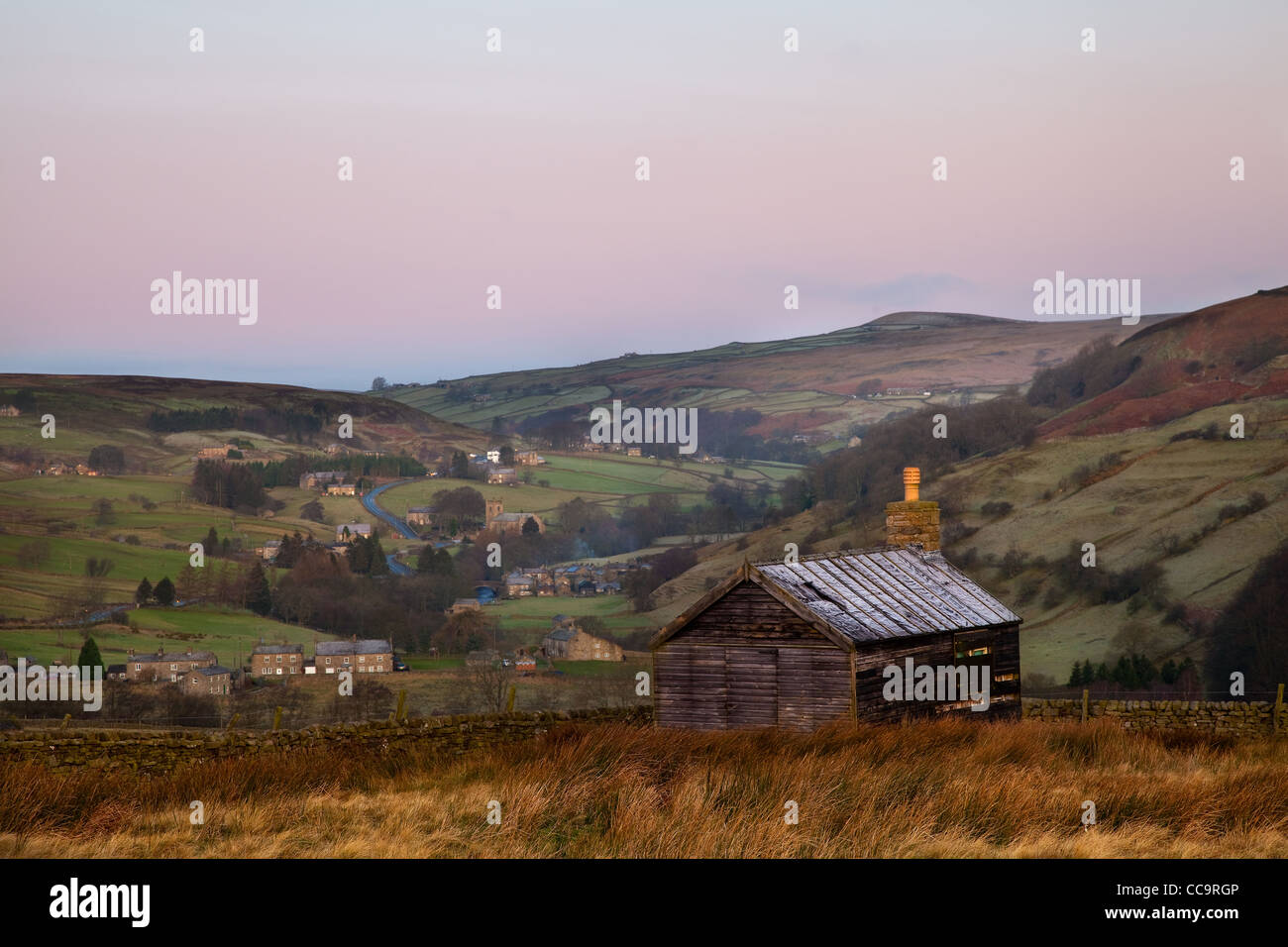 Decemberv dawn over the moorland cottage & village of Arkengarthdale, near Reeth, Swaledale, North Yorkshire Dales, UK Stock Photo