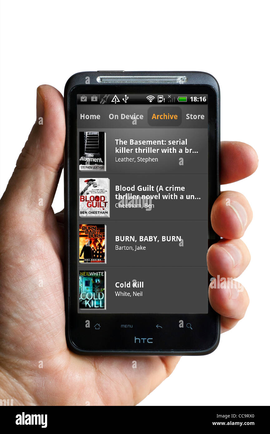 Looking at one's library on the Kindle app on an android HTC smartphone Stock Photo