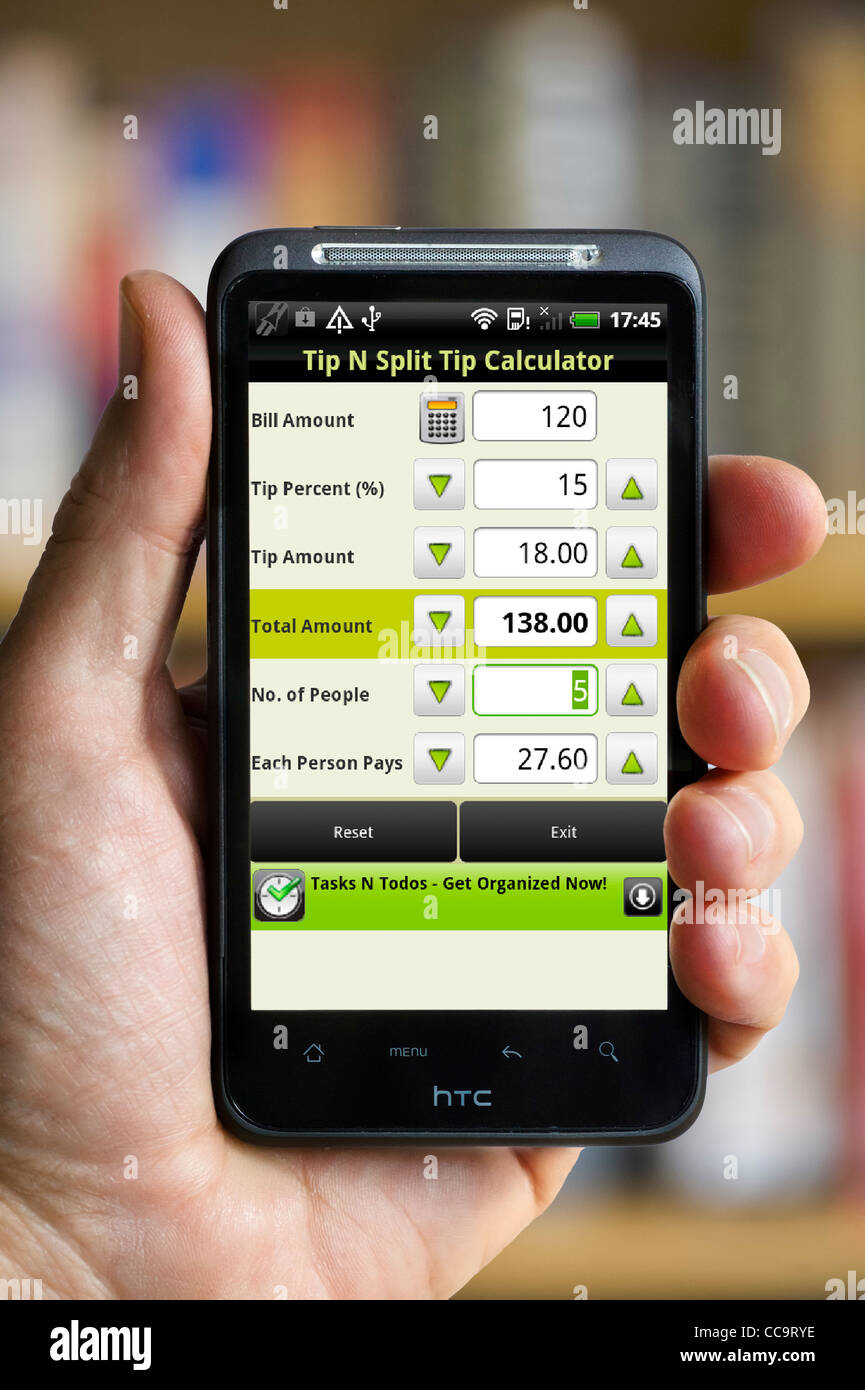 Using a Tip Calculator app on an android HTC smartphone Stock Photo - Alamy