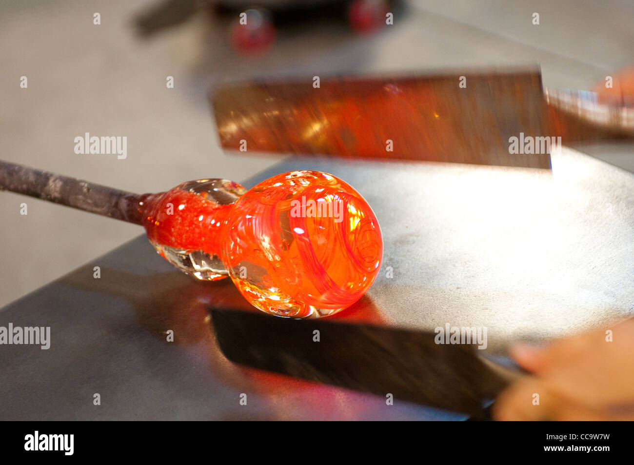 molten glass being rolled and shaped with tools on a table. Glass Roots,  Newark New Jersey, USA Stock Photo - Alamy