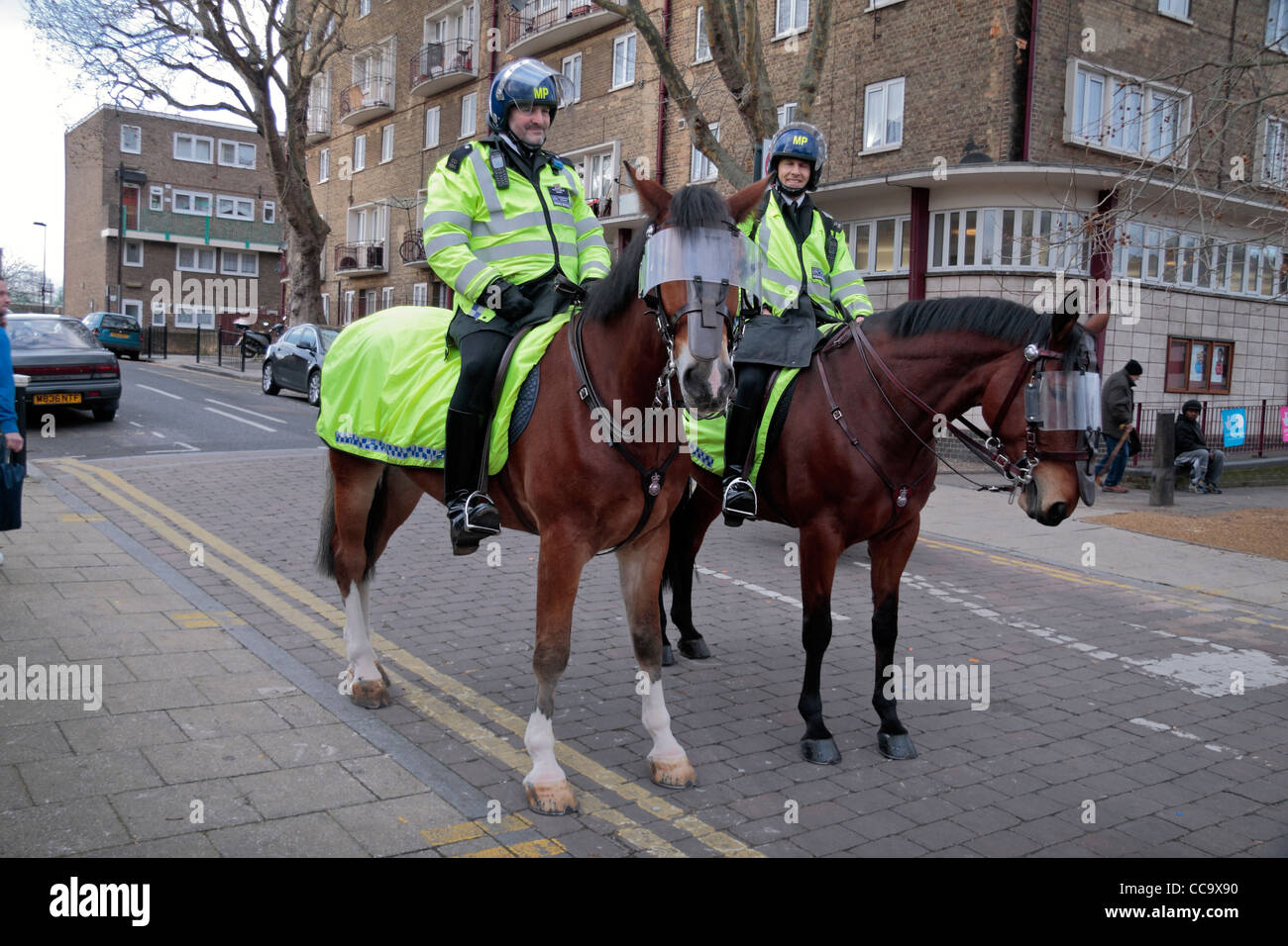 Two mounted Metropolitan Police Officers on patrol outside WHite Hart Land football Stadium in North London, UK. Stock Photo