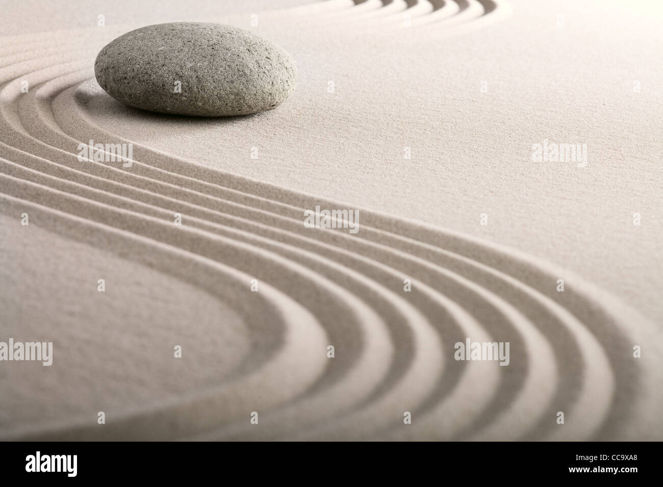 zen sand stone garden japanese meditation relaxation and spa image spiritual balance round rock Stock Photo