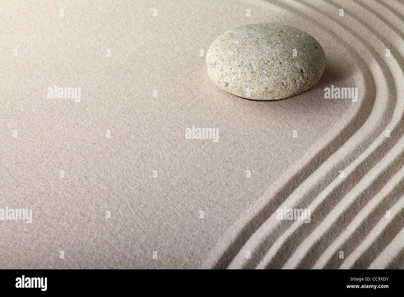 zen sand stone garden japanese meditation relaxation and spa image spiritual balance round rock Stock Photo