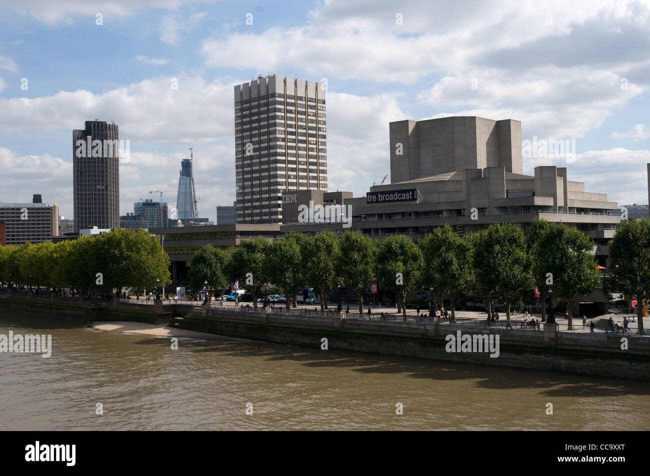 The view from Waterloo bridge towards the south bank of the River Thames. The Royal National theatre is on the right. Stock Photo