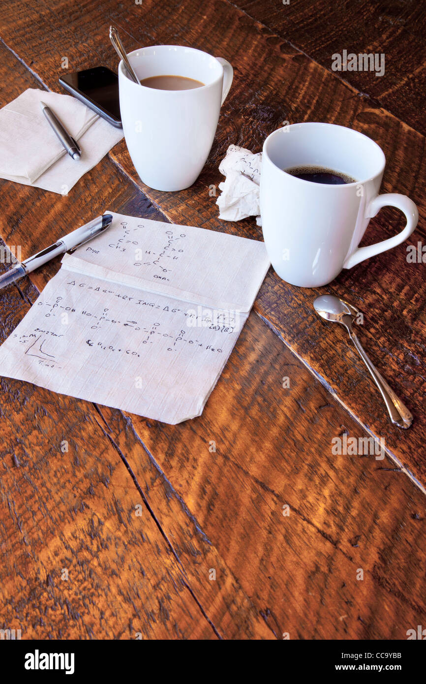 Molecular calculations on a paper napkin on a coffee shop table Stock Photo