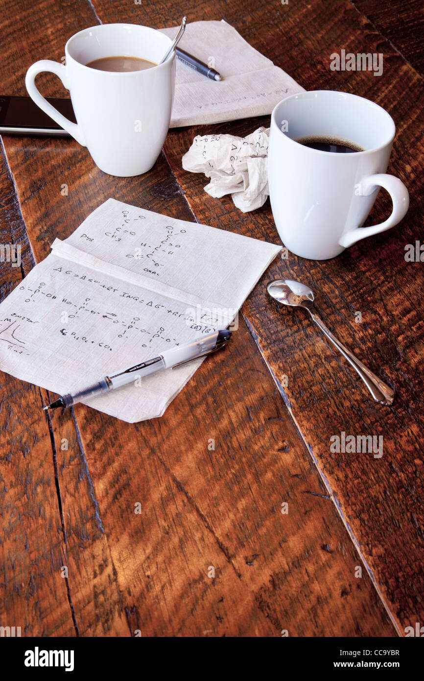 Molecular calculations on a paper napkin on a coffee shop table Stock Photo
