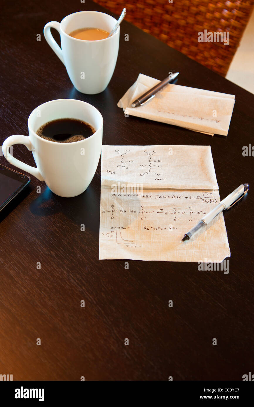 Molecular calculations on a paper napkin on a coffee shop table Stock Photo