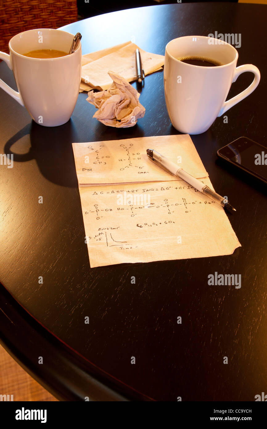 Molecular calculations on paper napkin on coffee shop table Stock Photo
