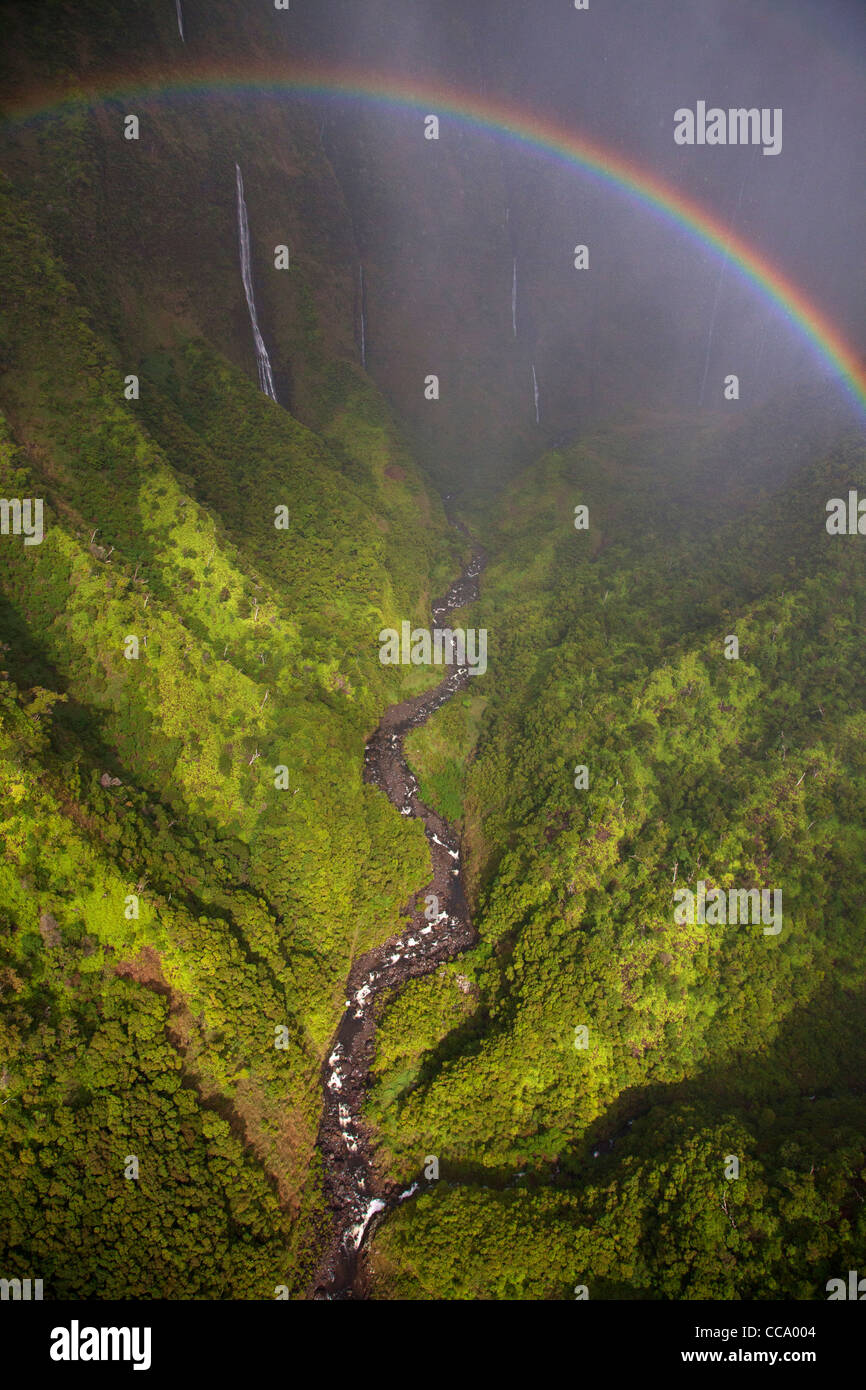 Aerial of a rainbow and waterfalls over Kauai, Hawaii. Stock Photo