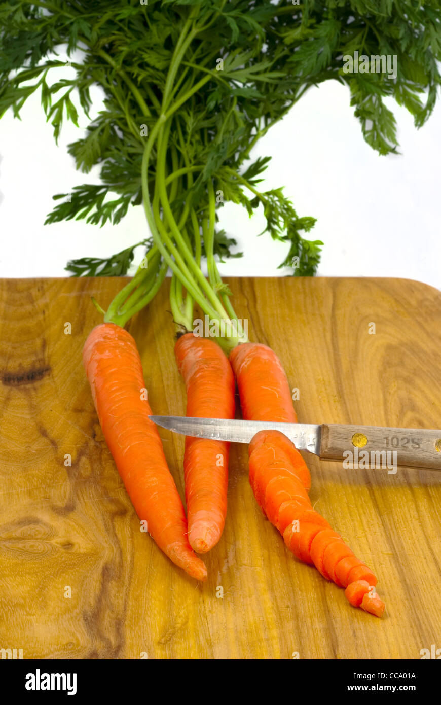 Cutting Carrots with a knife Stock Photo Alamy