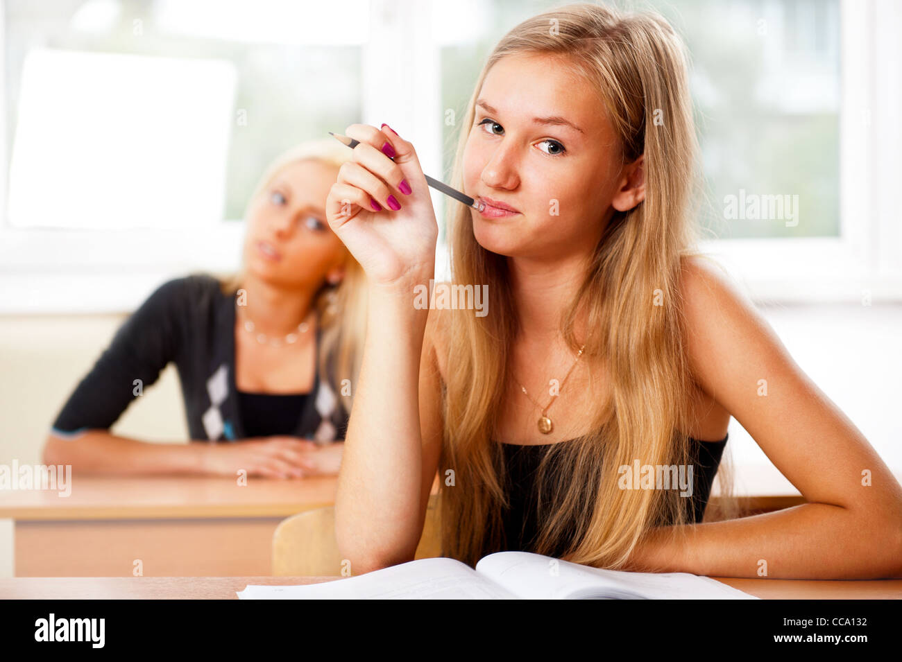 Portrait of a young group of students paying attention in class Stock ...