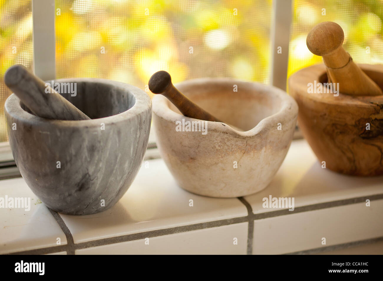 mortar and pestle collection in the kitchen of chef Mary Jane Curry, Camarillo, California, United States of America Stock Photo