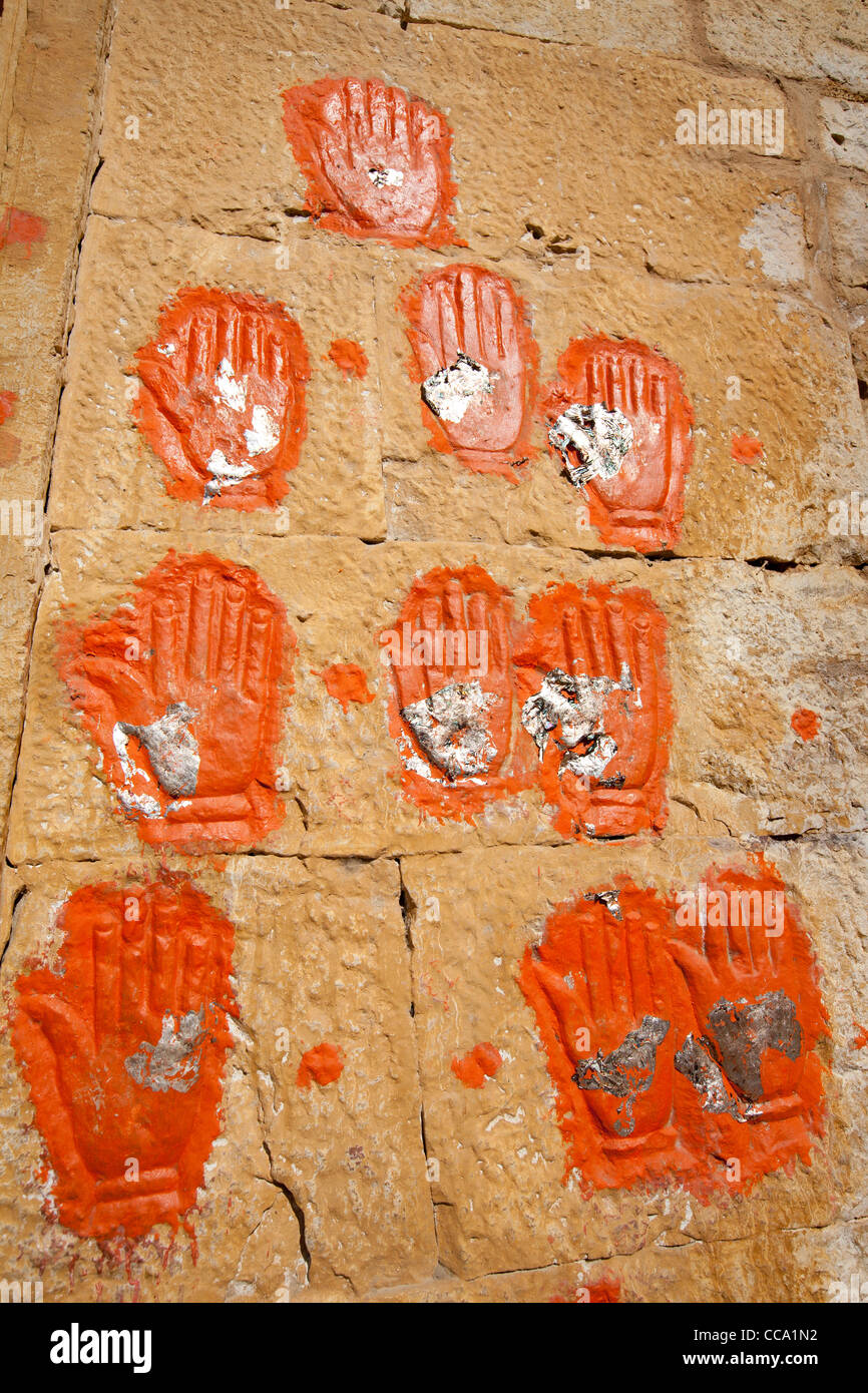 Sati handprints on the wall of the Fort Palace and Dashera Chowk, in Jaisalmer Fort, in Rajasthan, India. Stock Photo