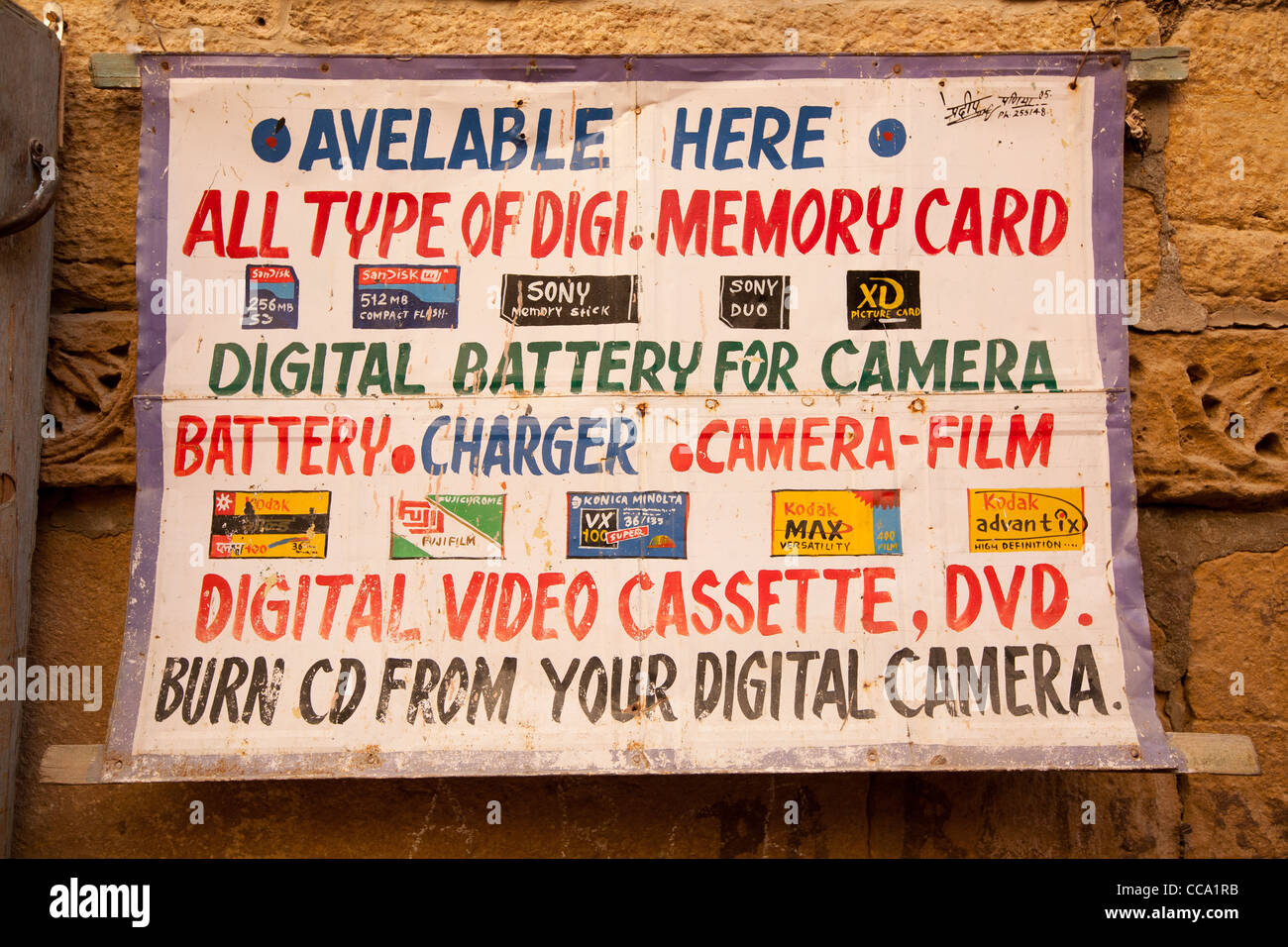 Tourist sign, advertising digital media memory cards, batteries, video, film etc…inside Jaisalmer Fort, in Rajasthan, India. Stock Photo