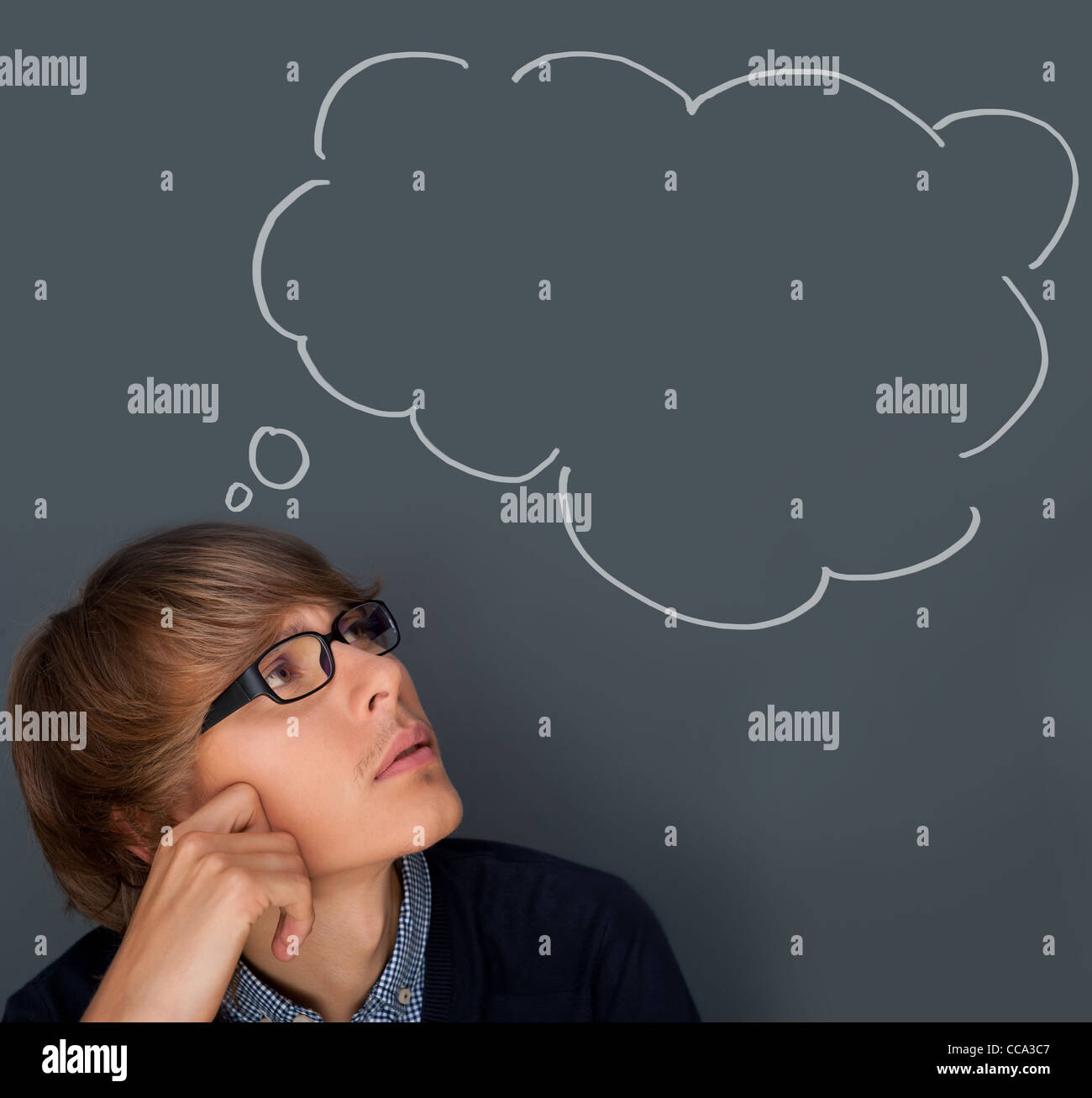 Image of young man thinking of his plans. Lots of copyspace inside ...