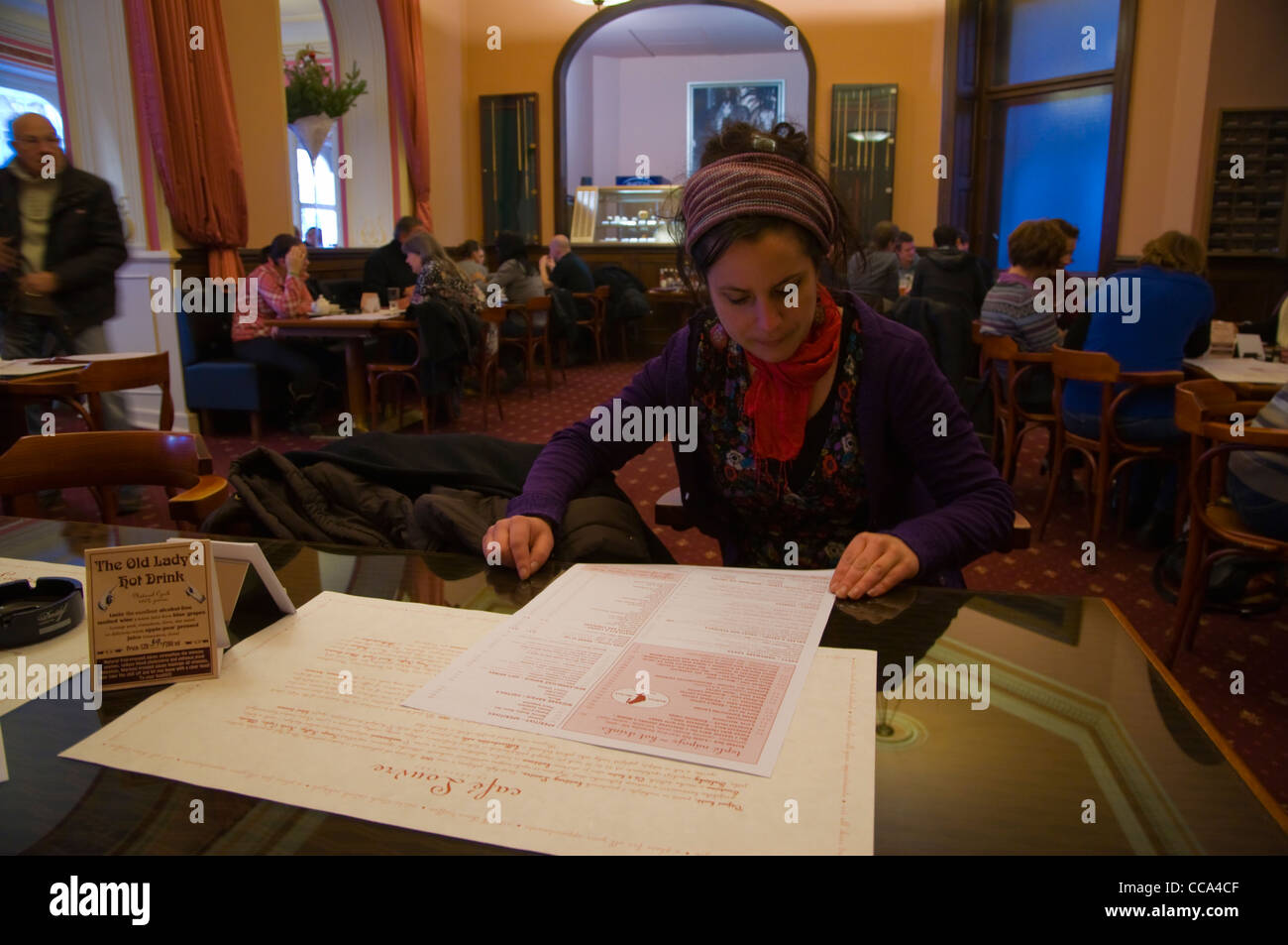 Customer studying the menu Cafe Louvre central Prague Czech Republic Europe Stock Photo Alamy