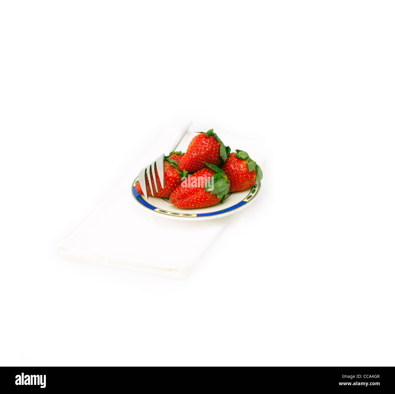 fresh strawberries on little dish isolated over white Stock Photo - Alamy