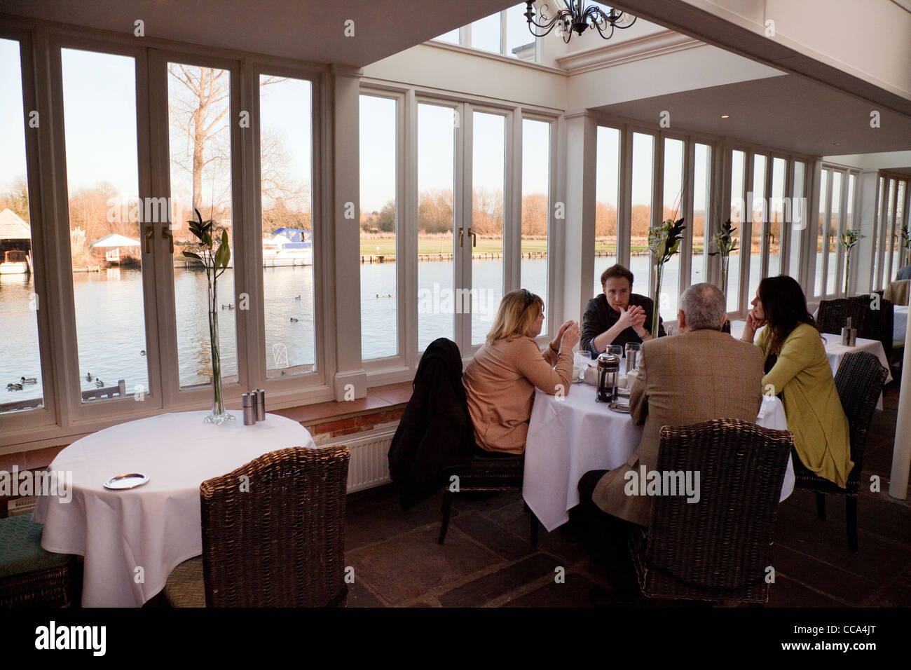 People eating in the Beetle and Wedge pub restaurant on the river Thames at Moulsford Oxfordshire UK Stock Photo