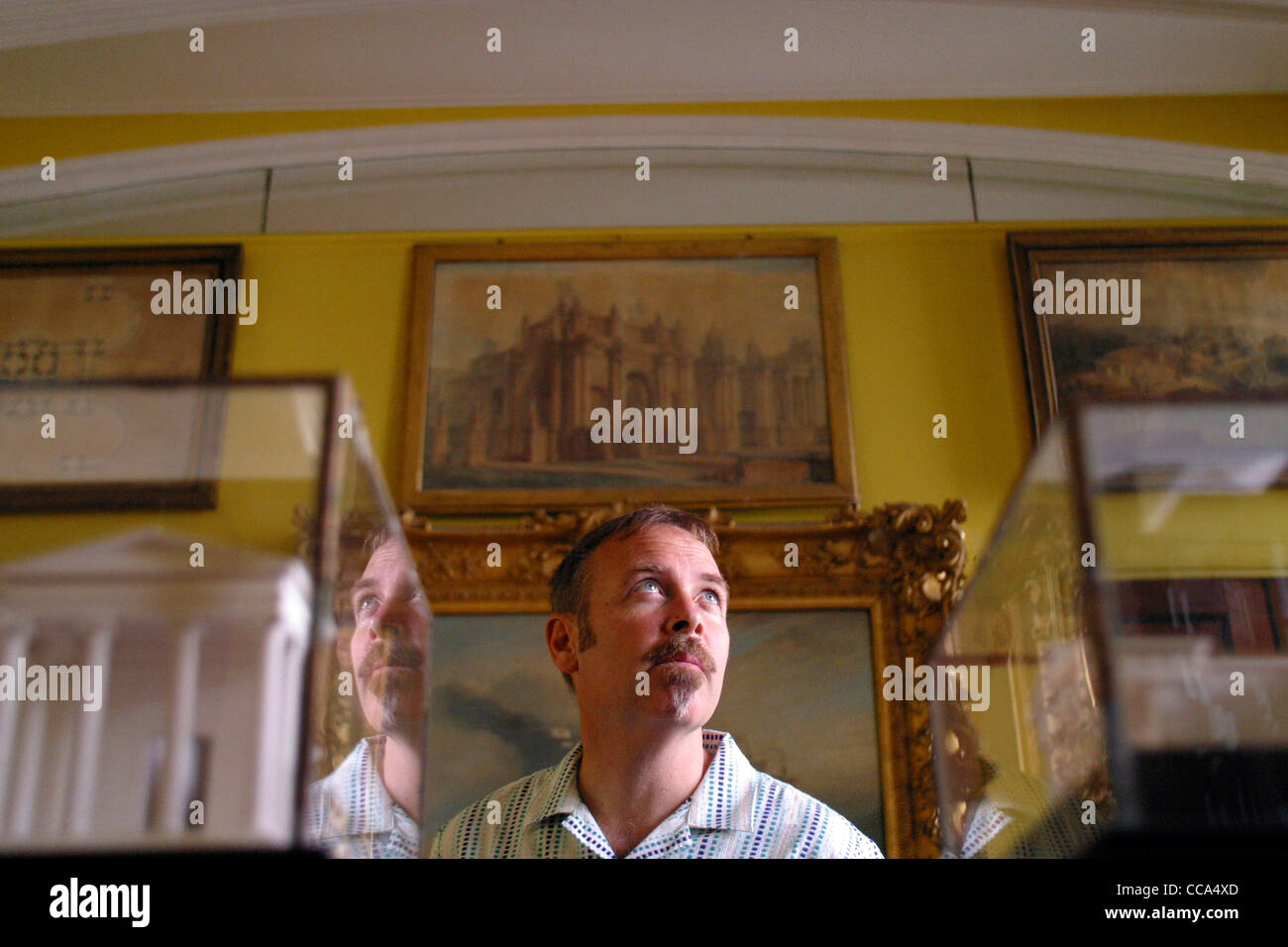 A visitor to the Sir John Soanes Museum, London looking at the exhibits. Stock Photo