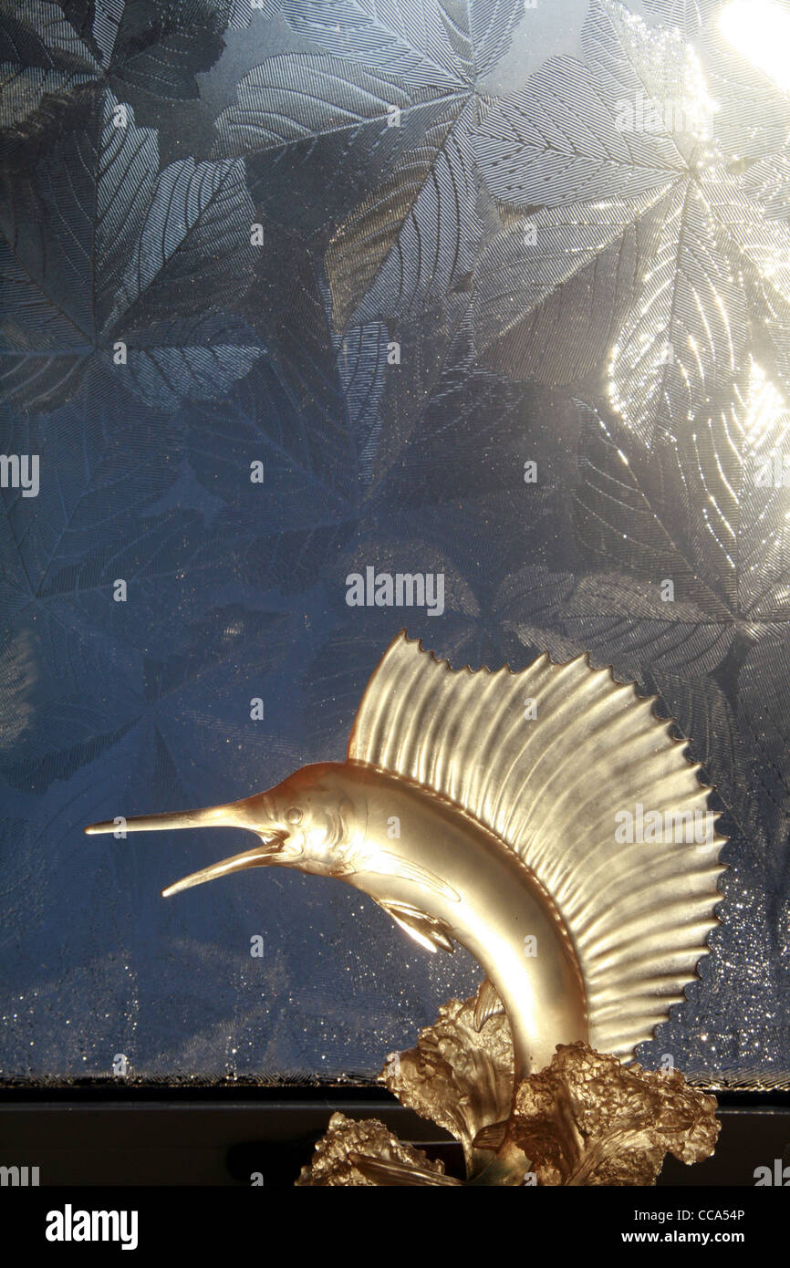 marlin fish ornament by bathroom window Stock Photo Alamy