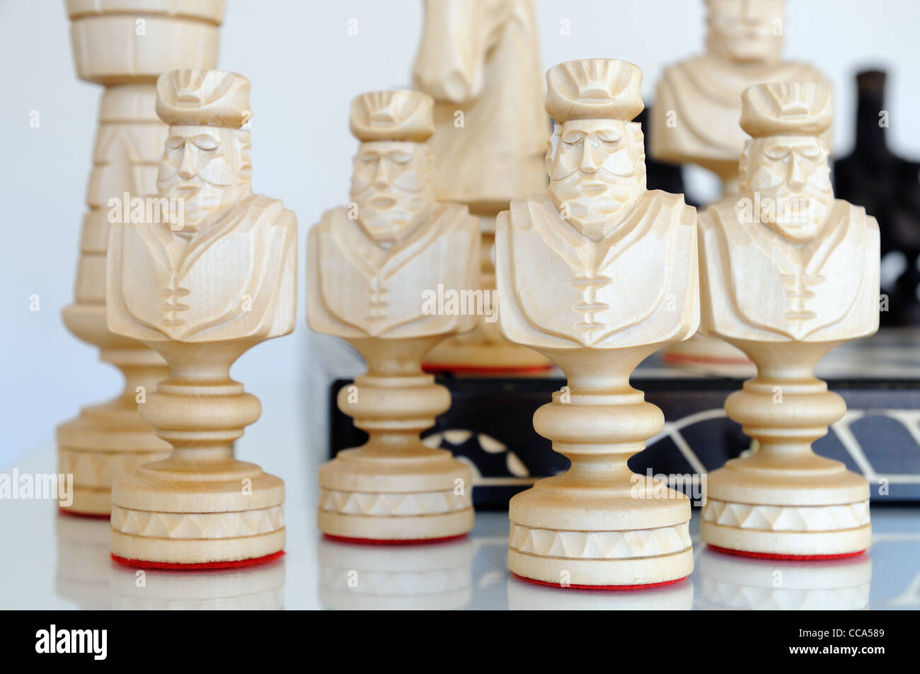 Chess pieces on wood board, black and white Stock Photo