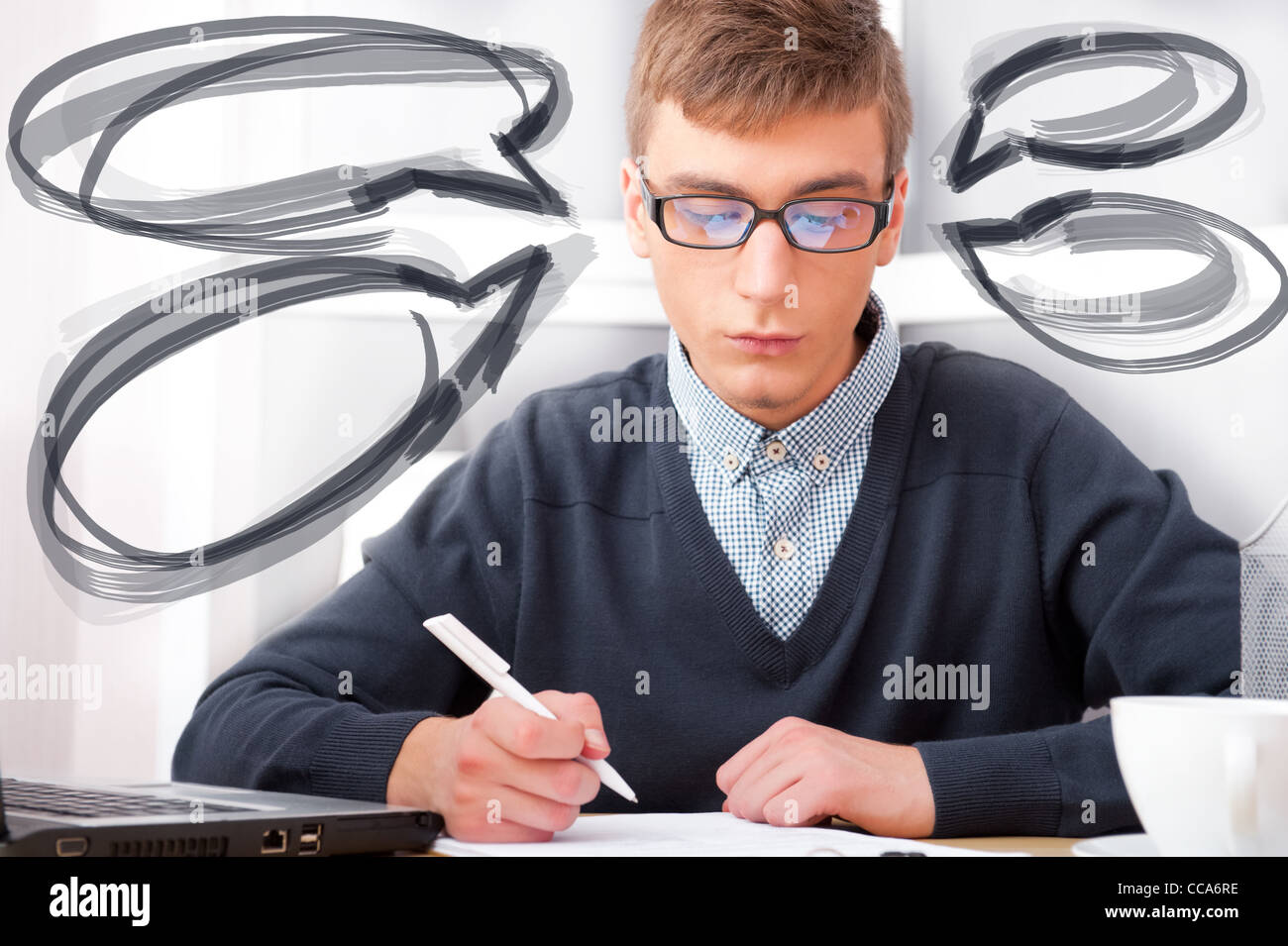 High school Young male student write notes in classroom. Design blank balloons with his