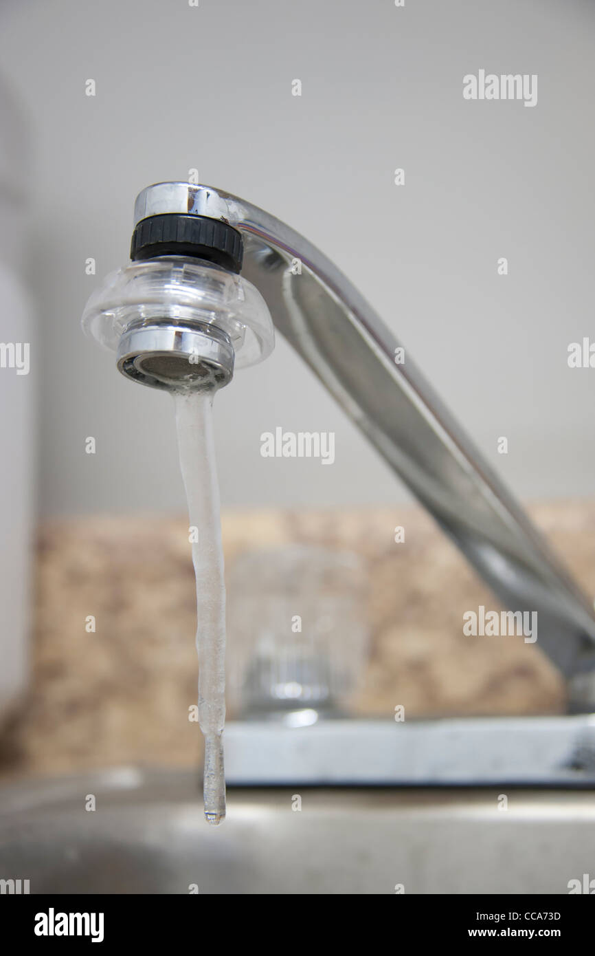Cold Home A frozen kitchen faucet Stock Photo Alamy