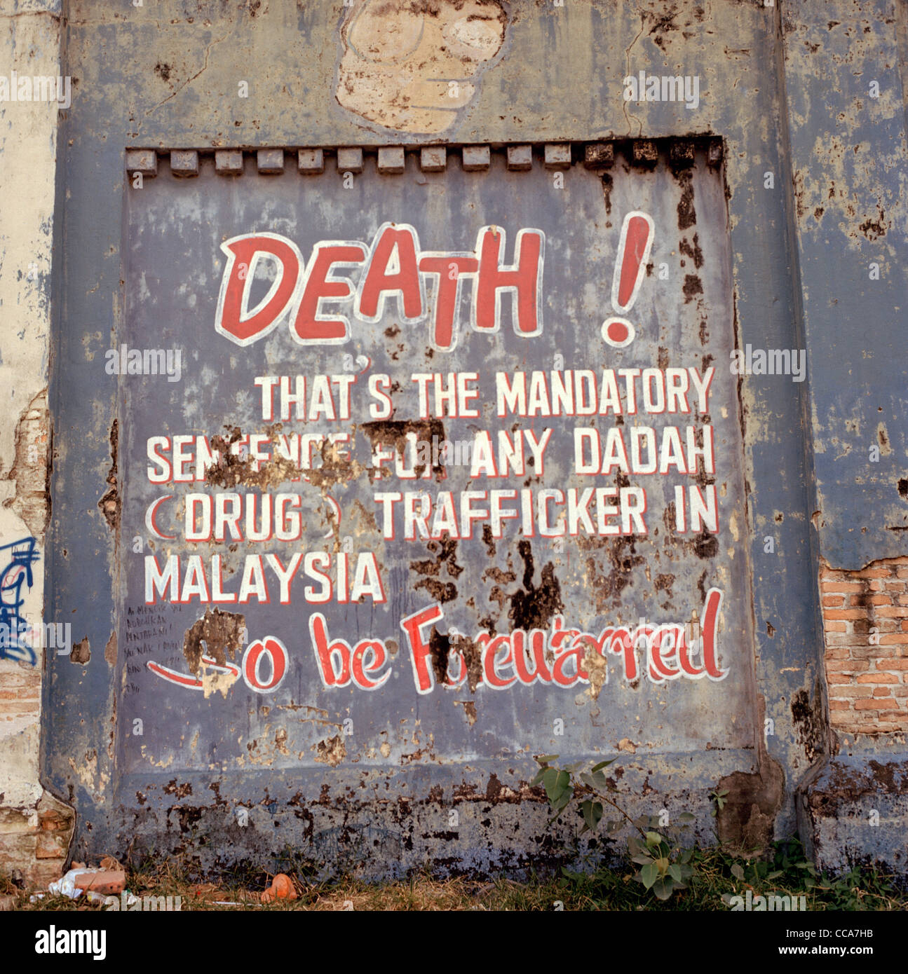 A warning of the death penalty for drug trafficking on the wall of Pudu Prison in Kuala Lumpur in Malaysia in Far East Southeast Asia. Narcotics Art Stock Photo