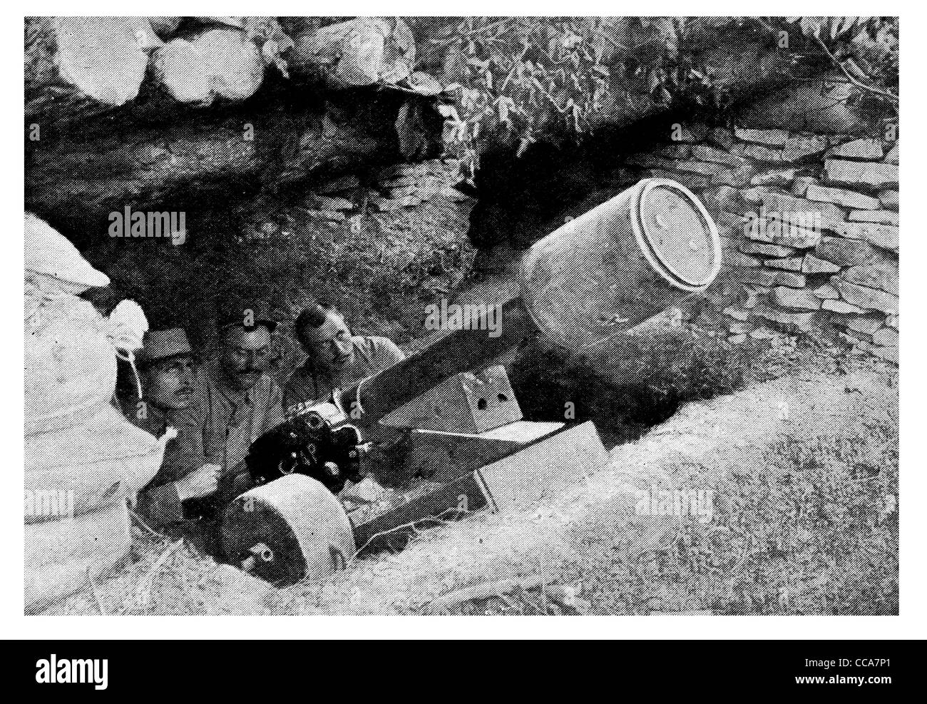 1915 French trench artillery 80 mm mountain gun fire air mines 130 pound mine dug out mortar gunner crew  shell Stock Photo