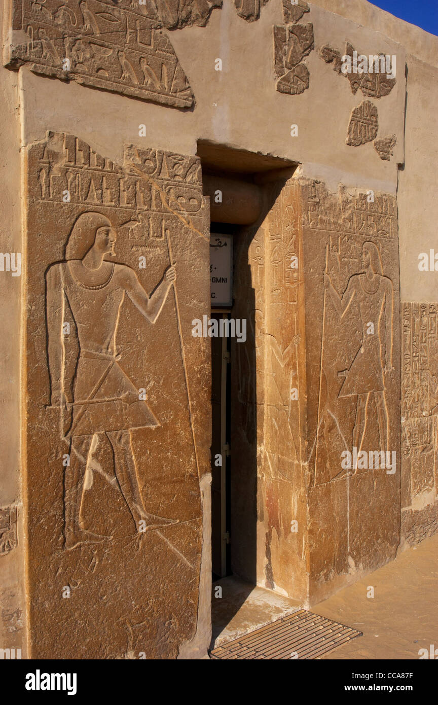 Mastaba of Kagemni (2350 BC). Reliefs on both sides of the door depicting Kagemni with the baton and scepter. Saqqara. Egypt. Stock Photo