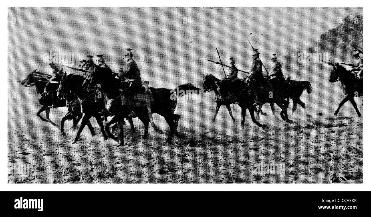 1915 German Uhlan Cavalry charge battle toward French Infantry lance saber horse field  charging mounted saddle officer Stock Photo
