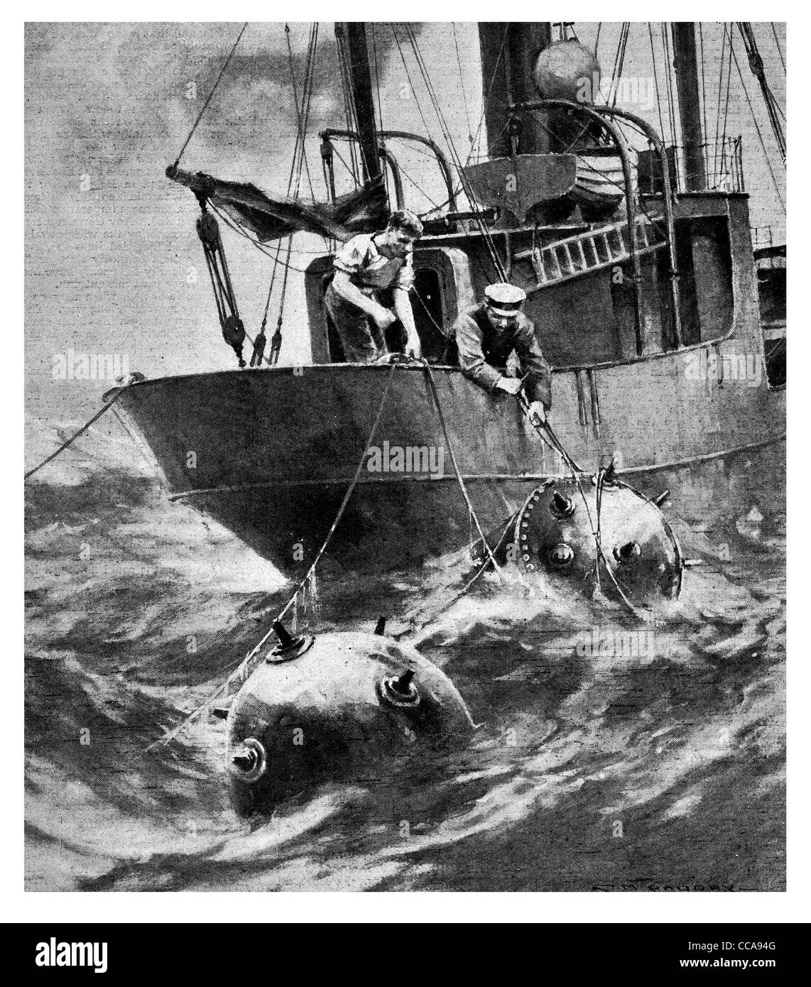 1917 2 sailors trawler cutting mines free mine explosive danger explosive explosives ship high seas ocean fishing boar scared Stock Photo
