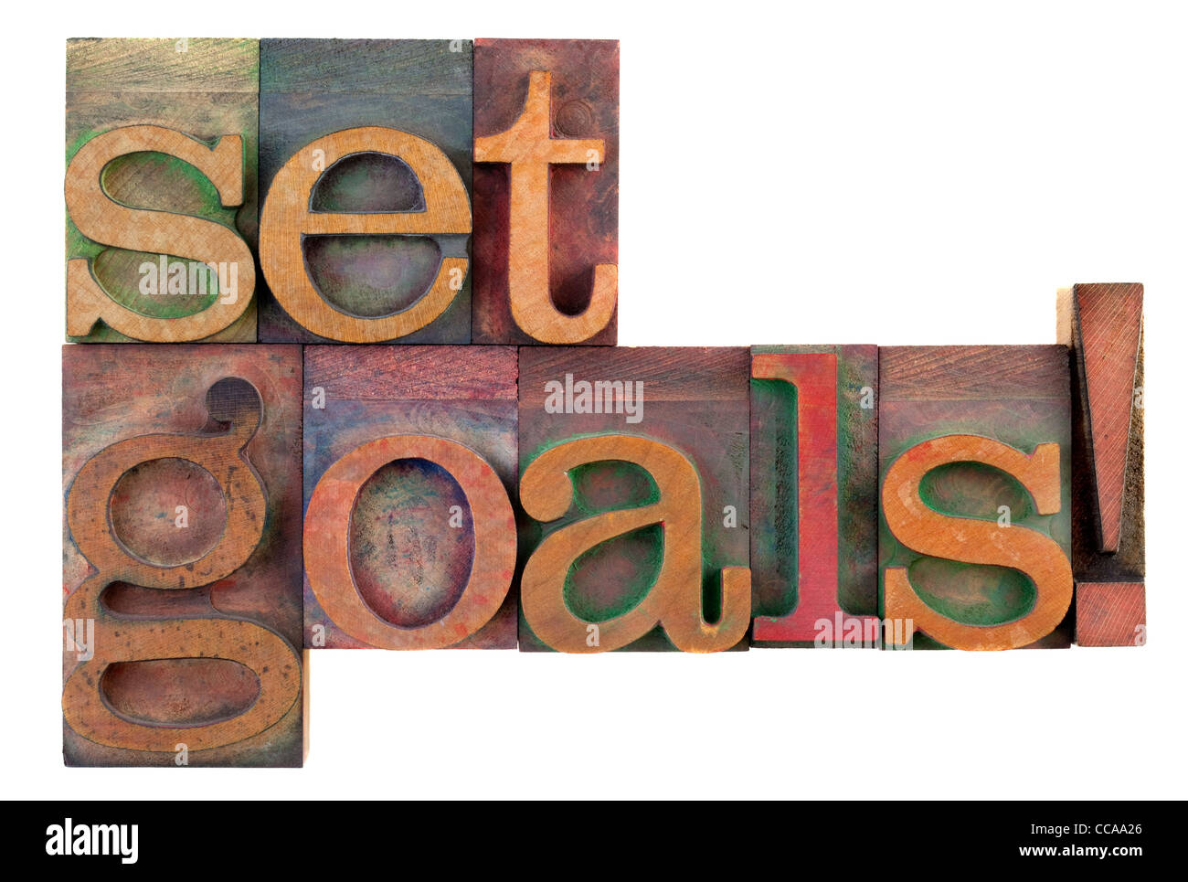 Set goals reminder in vintage wooden letterpress type blocks, stained by color ink, isolated on white Stock Photo