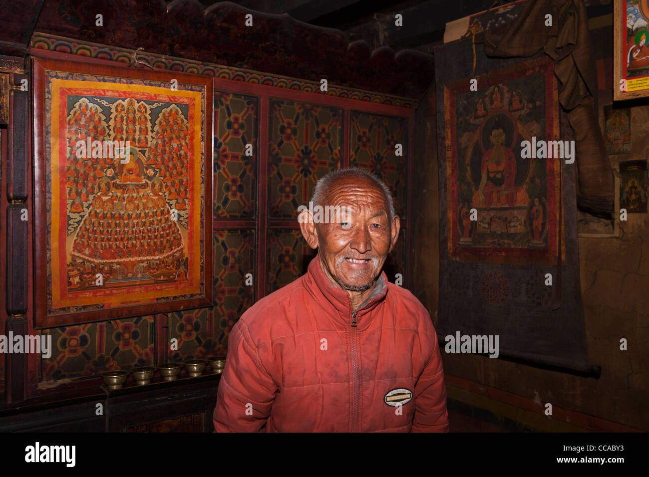 India, Arunachal Pradesh, Tawang, Lhou village, house interior elder Monpa royal family member in prayer room Stock Photo