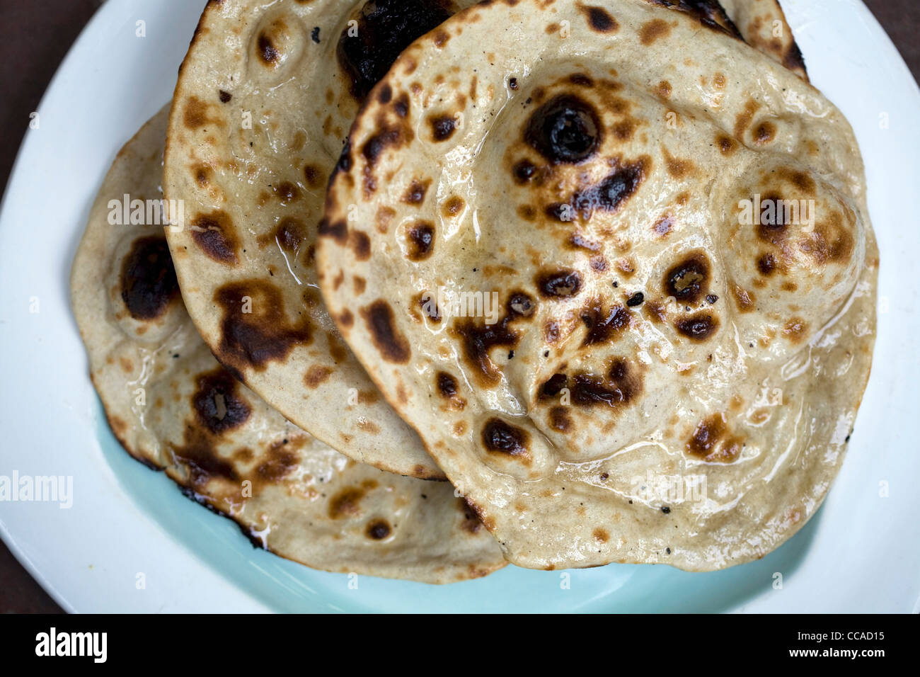 A plate of chapati bread at the Village Restaurant in Siri Fort, New Delhi Stock Photo