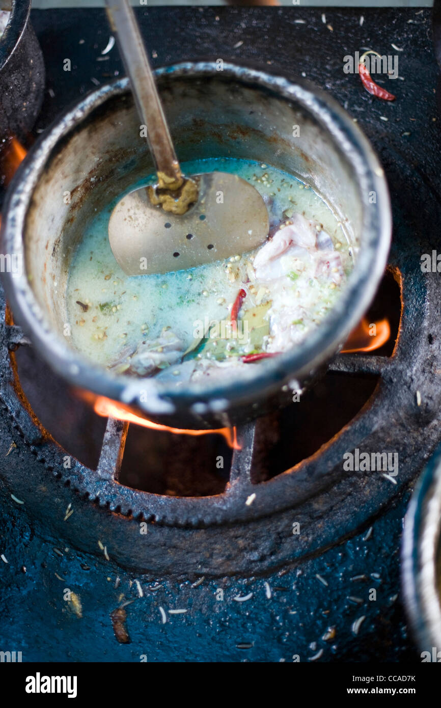 A curry cooking in a pot at Babu Shahi Bawarchi, New Delhi, India Stock Photo Alamy