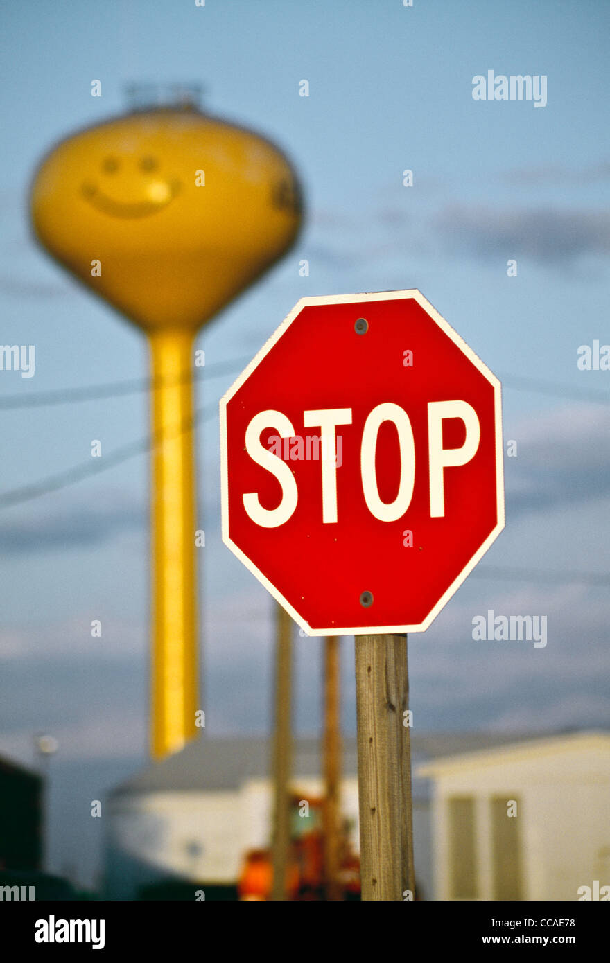 Yellow "SmileyFace" Water Tower and Stop Sign, Adair, Iowa, USA