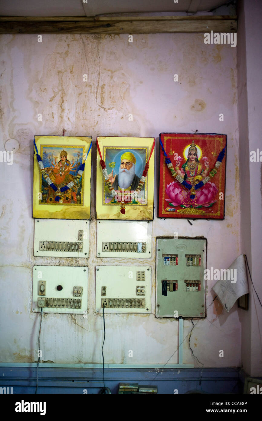 A shrine by the counter at Moti Mahal Restaurant in Old Delhi, India Stock Photo
