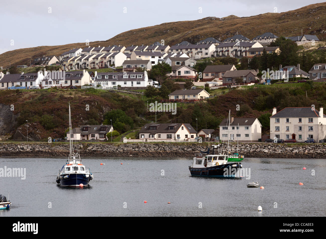 Hillside housing estate above the bay at Mallaig Scotland Stock Photo
