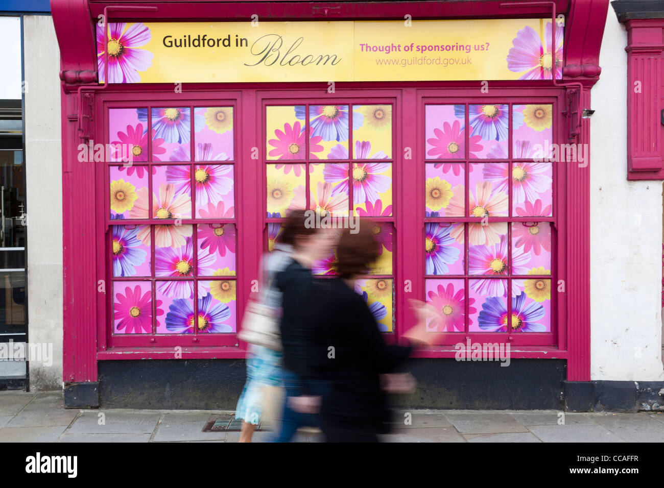 Pedestrians walk past floral hi-res stock photography and images - Alamy