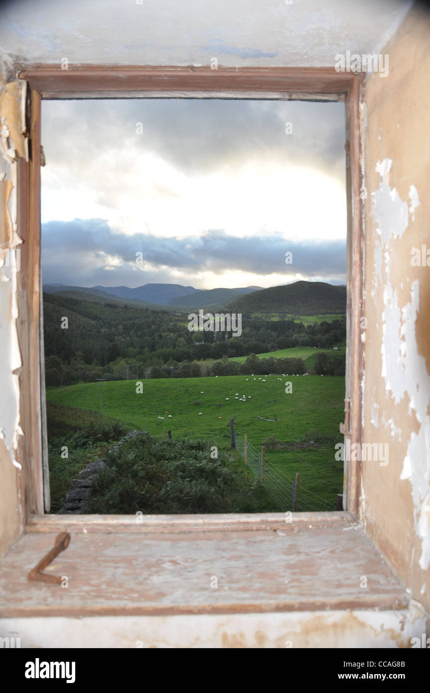View from within derelict farmhouse, overlooking Balmoral castle, and upper deeside, Aberdeenshire, Scotland, UK Stock Photo
