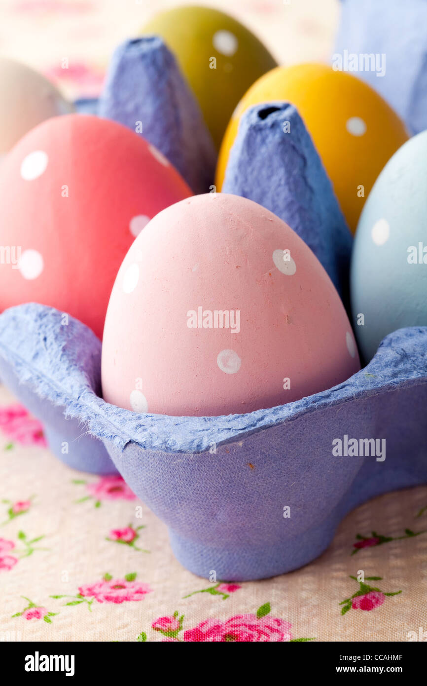 Close-up of pastel colored Easter eggs in a blue carton Stock Photo - Alamy