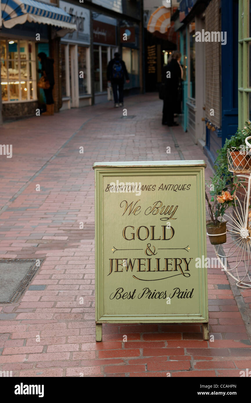 Sign outside a Brighton Lanes antique shop offering to buy Gold and Jewellery. Brighton East Sussex England UK Stock Photo