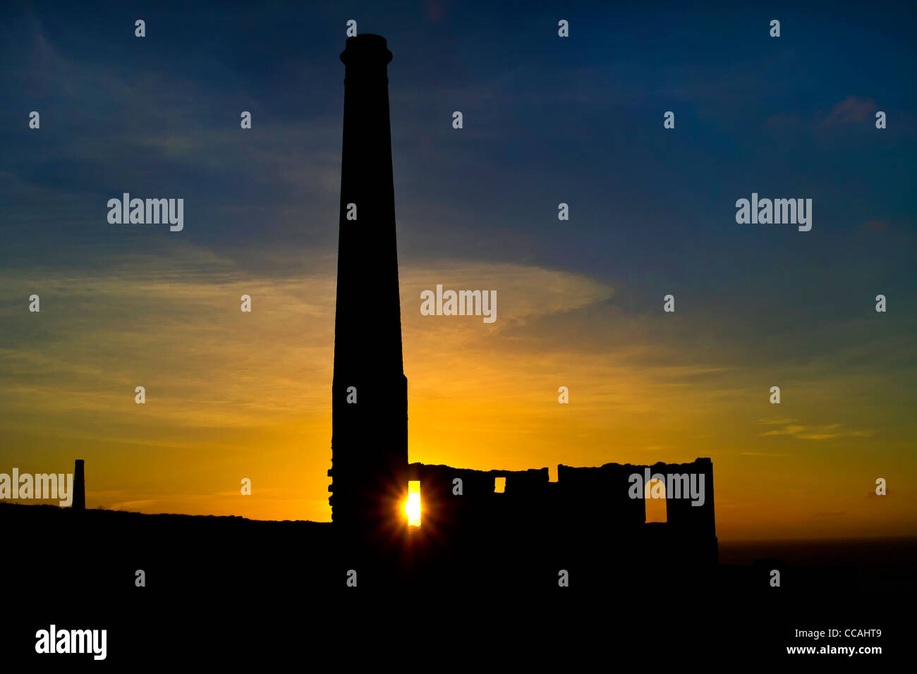 an old tin mine building with sunset Stock Photo