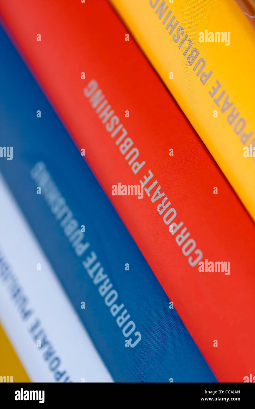 Colorful collection of annual reports in a row Stock Photo