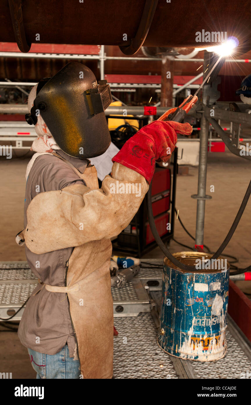 A welder during welding activities in a workshop Stock Photo Alamy