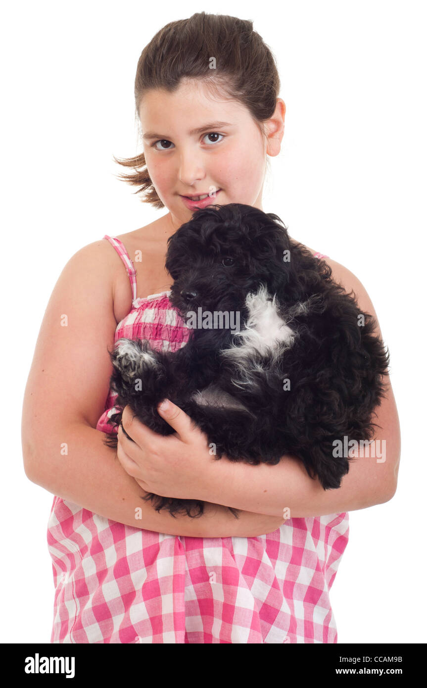 Little girl holding her dog Stock Photo - Alamy