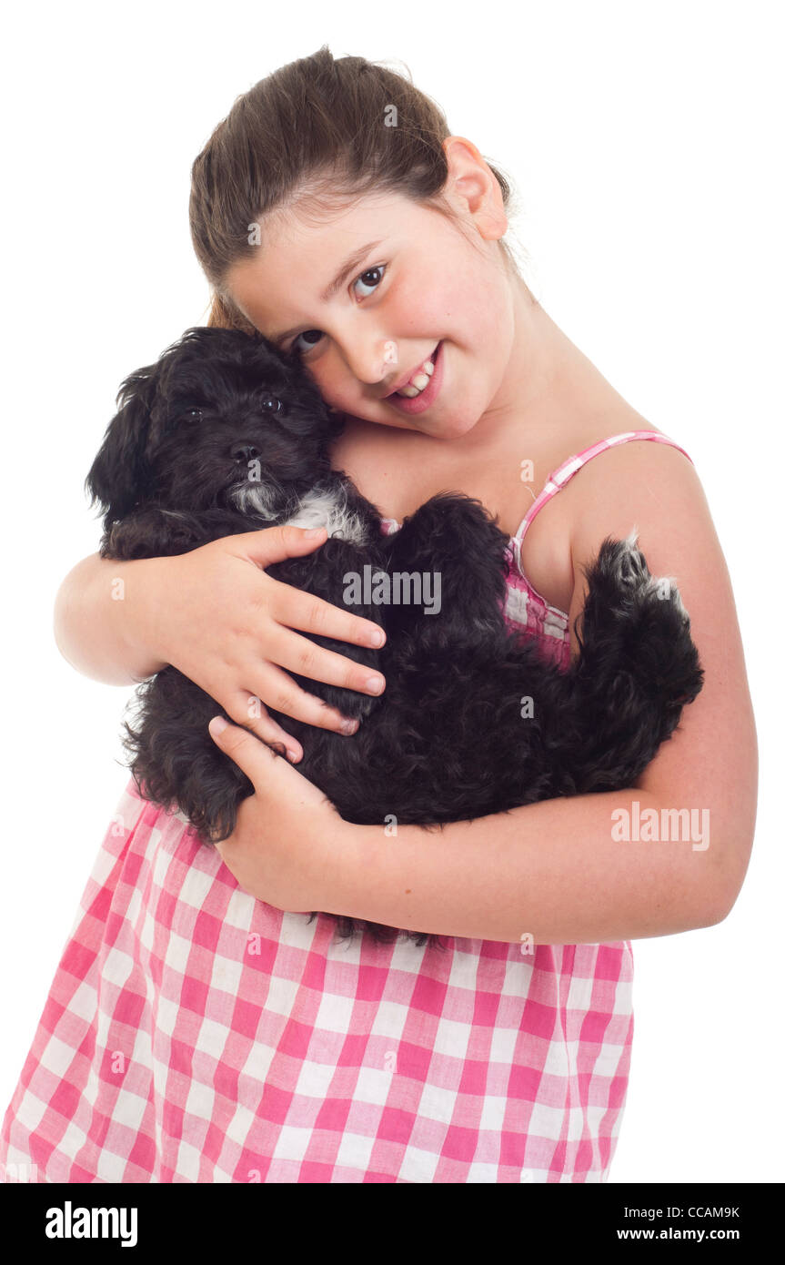 Little girl holding her dog Stock Photo - Alamy